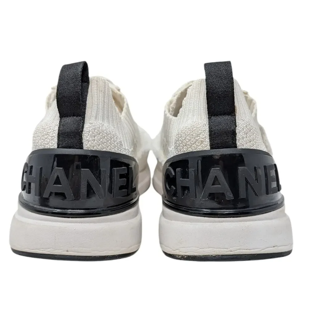 Chanel 2021 CC Logo Knit Sneakers Slip On White Black Athletic 39.5 | 9 | 8.5